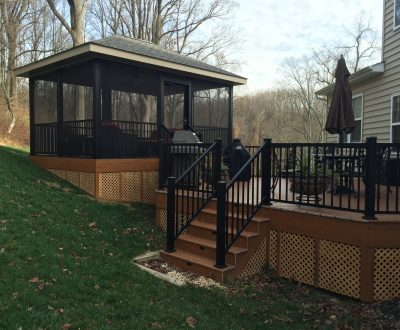 sun room addition separated from home on dark brown outdoor deck