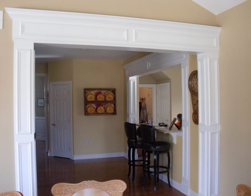 white painted wainscoting surrounding walkway